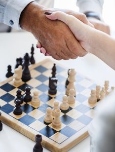 handshake over chess