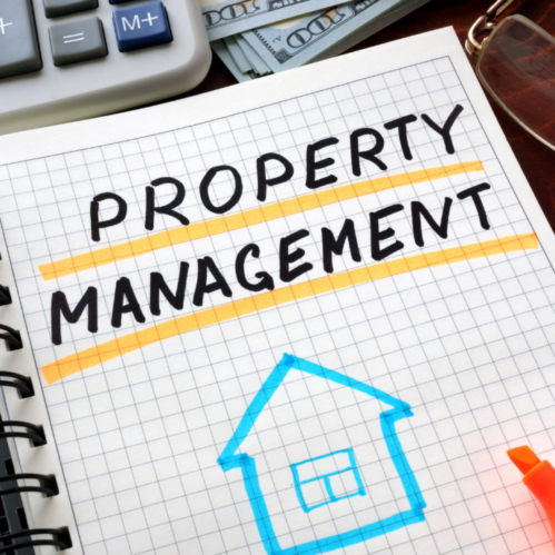 A binder with graph paper that features an illustration of a house and the phrase "Property Management"