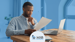 Multifamily professional reviewing his resume at a desk, MSB Resources